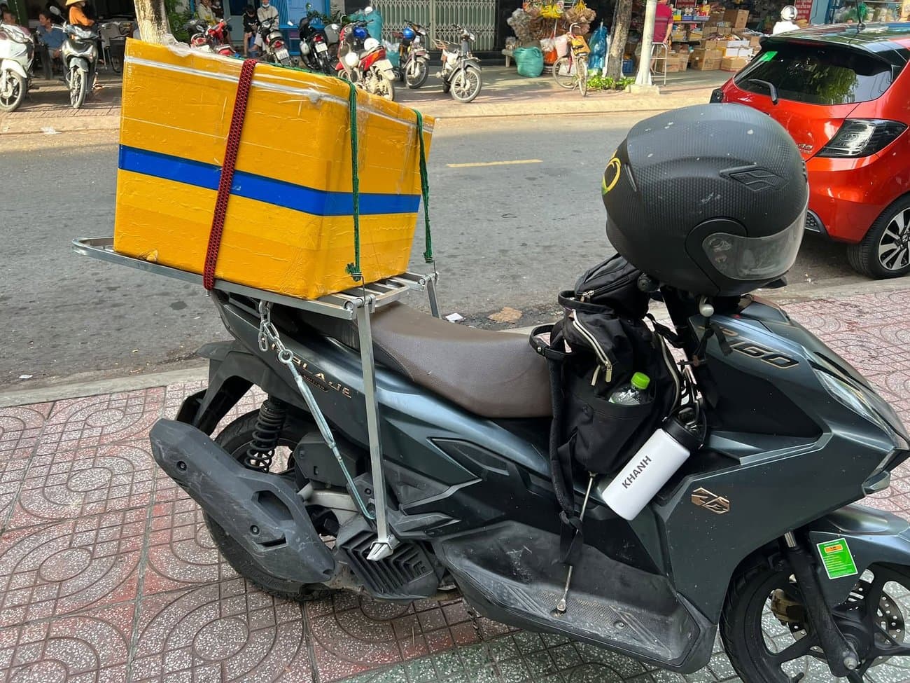 A motorbike rider delivering produce